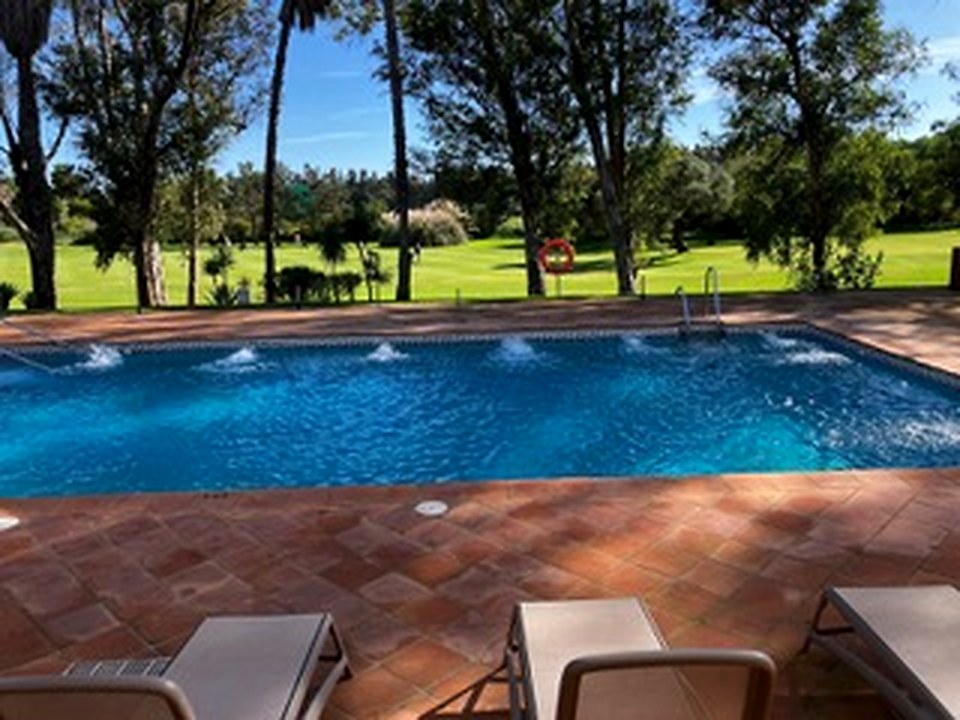 Resort pool overlooking the course