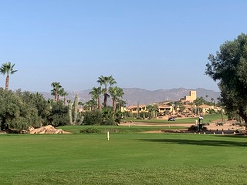 Clubhouse beside the closing fairway
